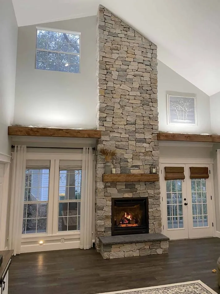 Tall stone veneer wall in a vaulted room
