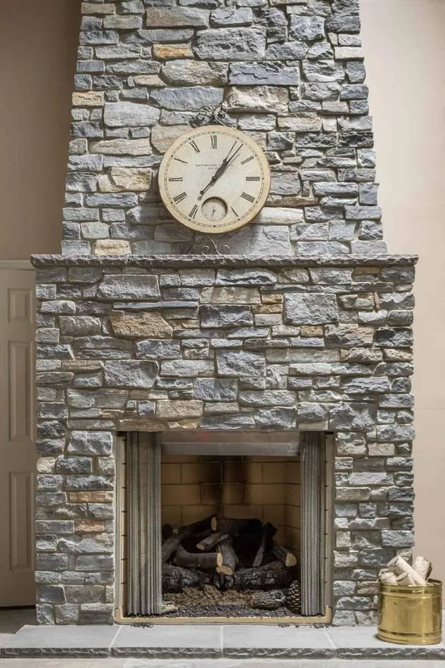 Stone veneer wall with mantel